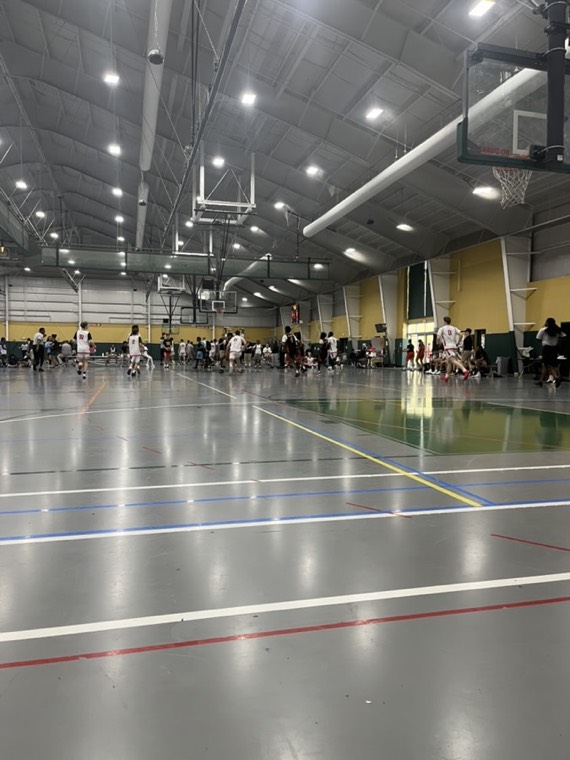 Game in a large indoor facility with several courts
