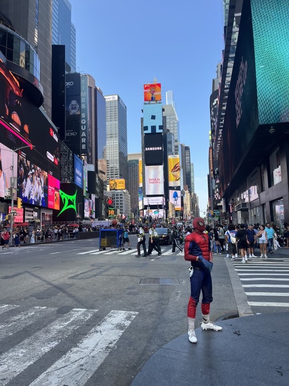 Times Square in New York with a street performer in a Spider-Man costume