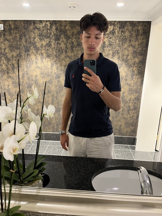 Mirror selfie in a navy polo